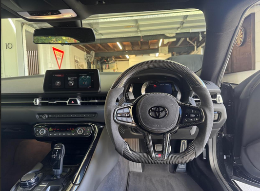 Supra interior with carbon fiber steering wheel installed inside the vehicle