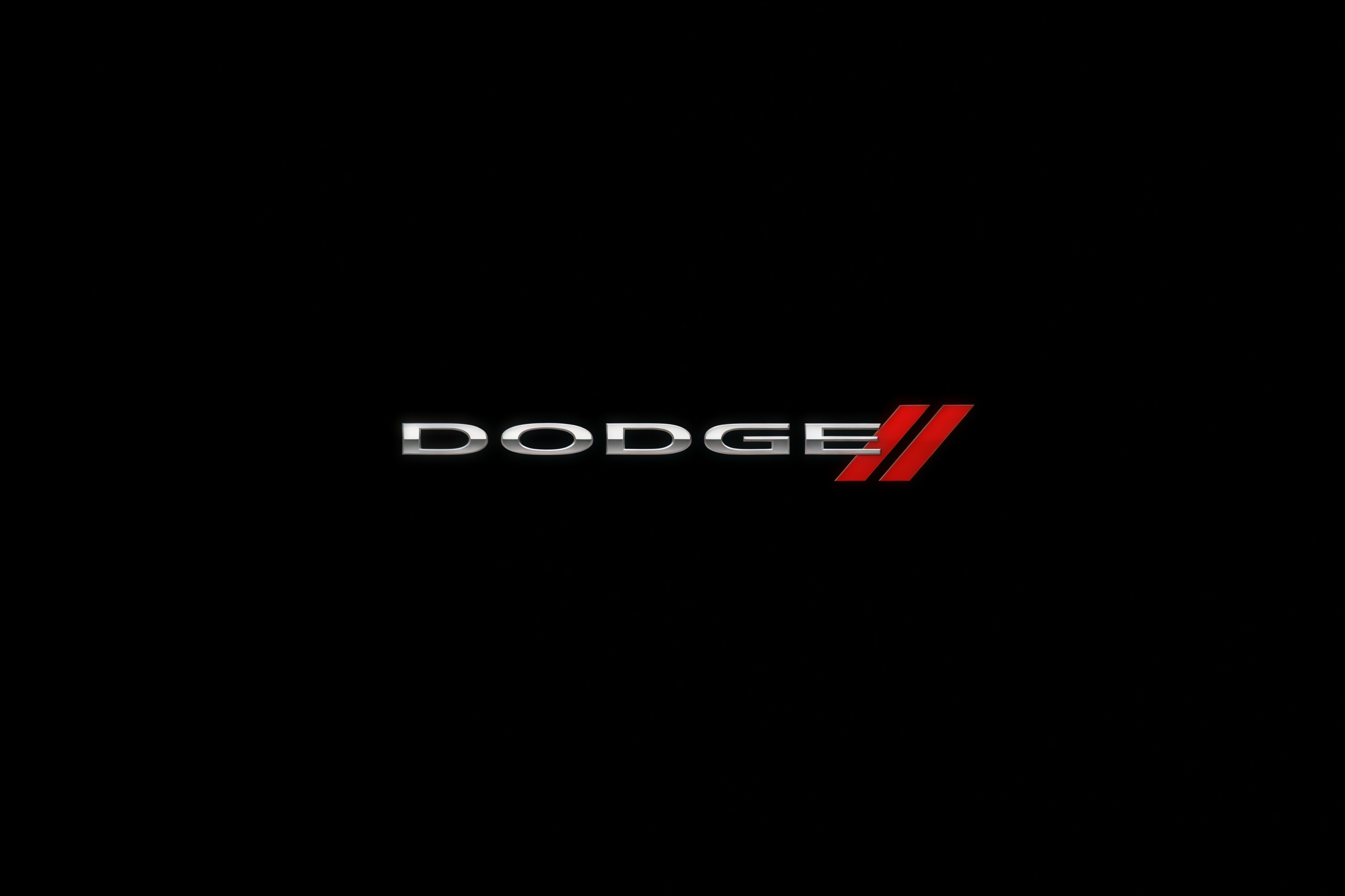 Dodge carbon fiber steering wheel with aggressive performance styling.