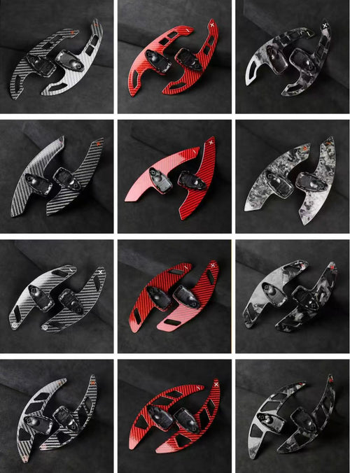 Extended carbon fibre paddle shifters in multiple finishes including gloss carbon, forged carbon, red forged carbon, and grey forged carbon.