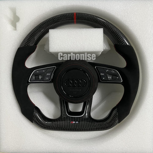 Custom Audi S6 steering wheel featuring gloss carbon fiber, a red top racing stripe, and black Alcantara side grips with red contrast stitching.