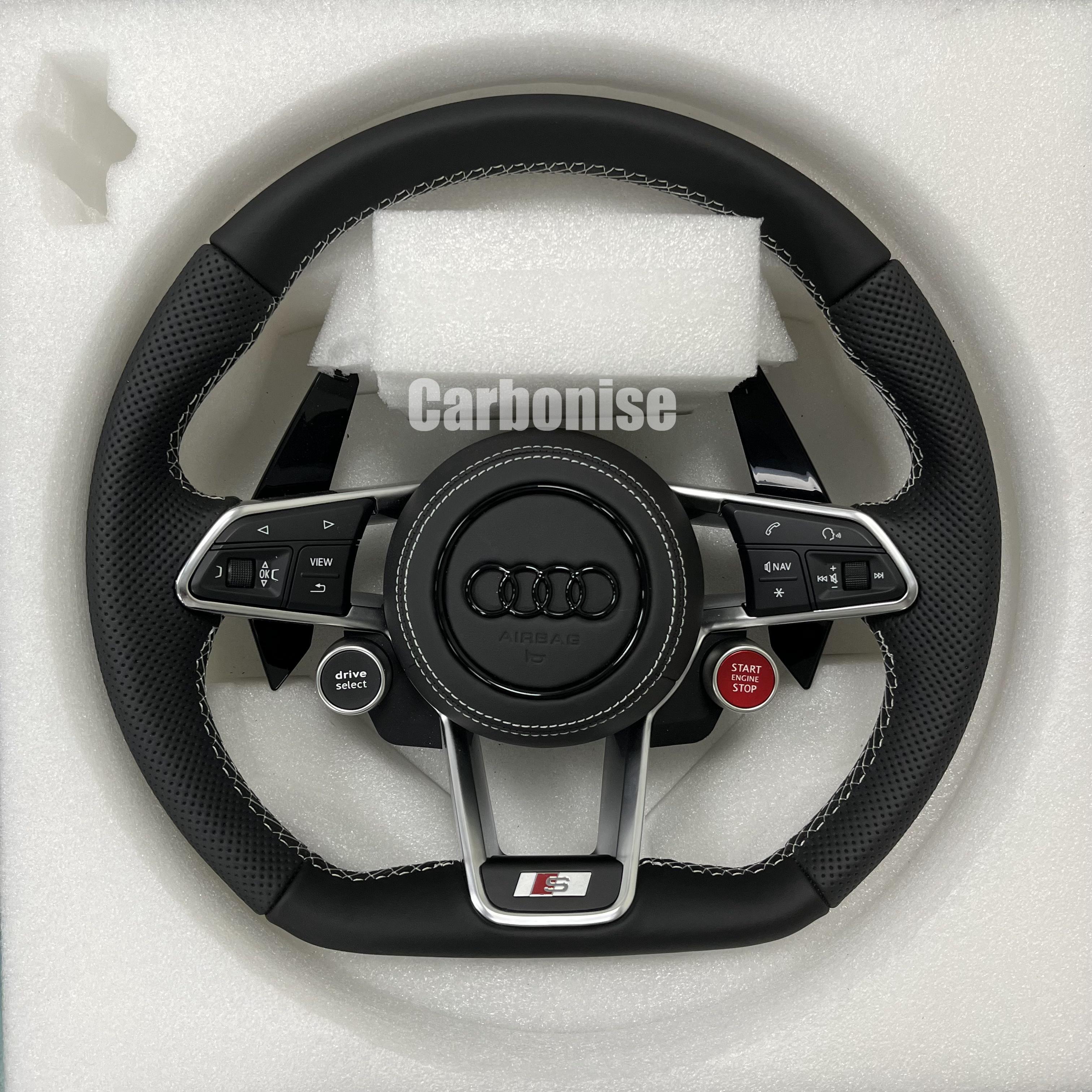 Custom Audi S performance steering wheel featuring black perforated leather grips, white contrast stitching, and integrated red Start/Stop and black Drive Select buttons.