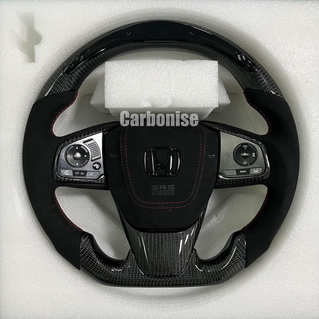 Custom Honda steering wheel with carbon fibre top and bottom, Alcantara side grips, red stitching, and integrated OEM multifunction controls