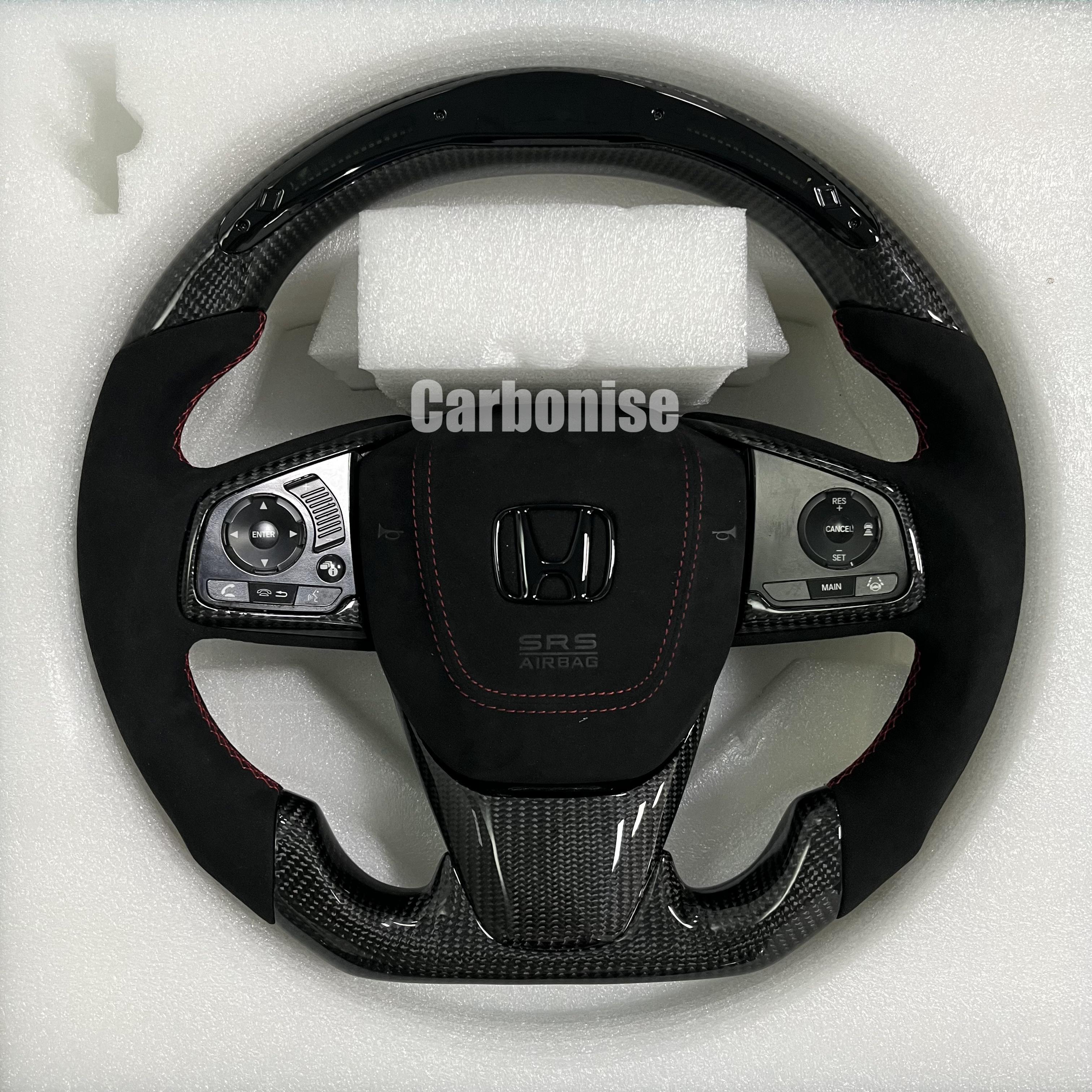Custom Honda steering wheel with carbon fibre top and bottom, Alcantara side grips, red stitching, and integrated OEM multifunction controls