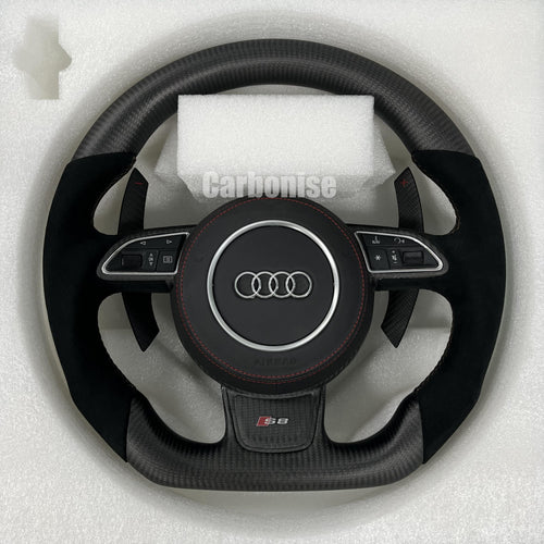 Custom Audi S8 steering wheel with a stealth matte carbon fiber finish, premium black Alcantara side grips, red stitching, and matching carbon fiber paddle shifters.