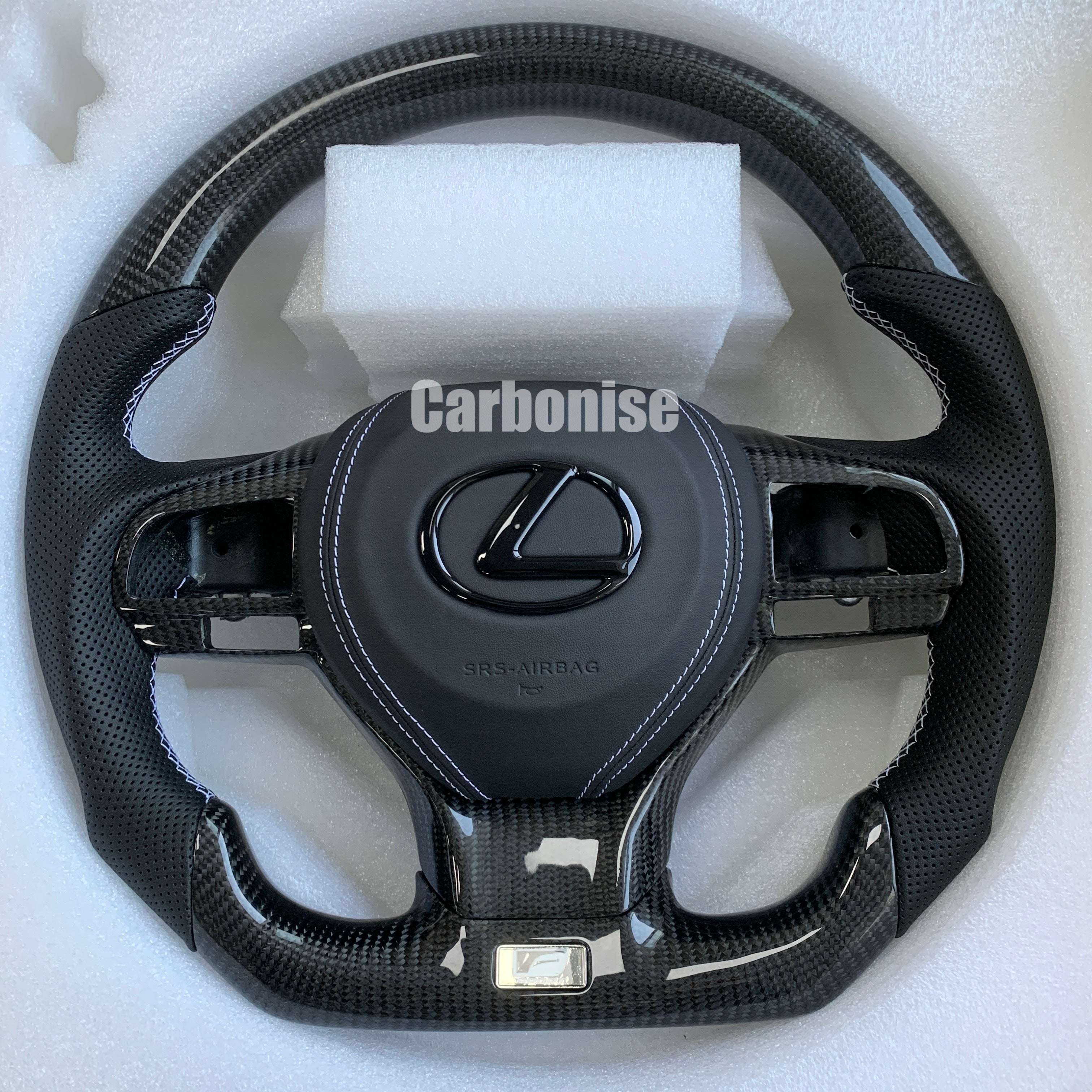 Carbonise Lexus carbon fiber steering wheel with perforated leather grip and white stitching