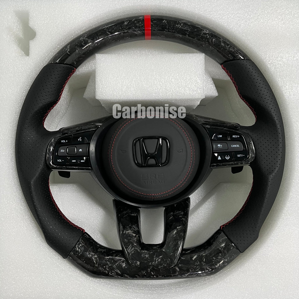 Custom Honda forged carbon steering wheel featuring a red center stripe, black perforated leather side grips, red stitching, and OEM Honda multifunction controls.