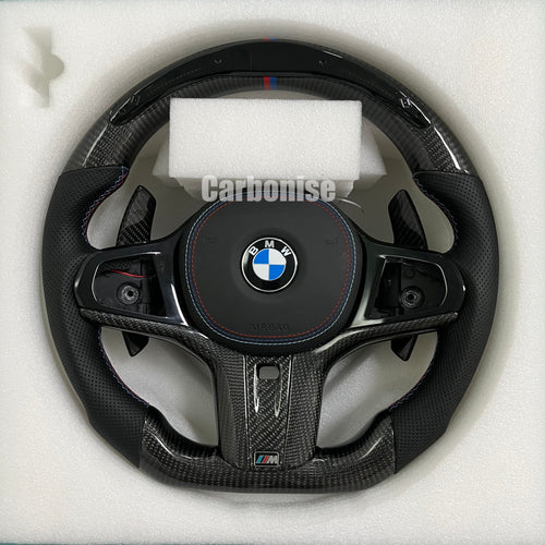 Custom BMW M steering wheel featuring high-gloss carbon fiber, a signature M-tri color top racing stripe, and black perforated leather side grips.