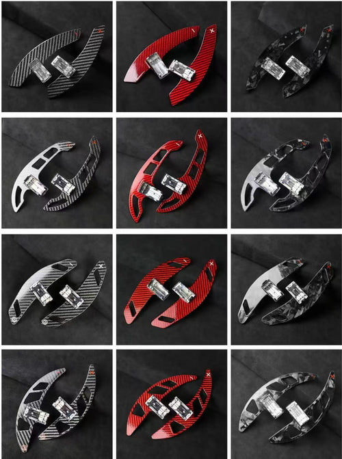 Extended carbon fibre paddle shifters in multiple finishes including gloss carbon, forged carbon, red forged carbon, and grey forged carbon.