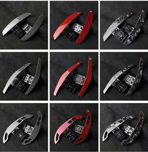 Extended carbon fibre paddle shifters in multiple finishes including gloss carbon, forged carbon, red forged carbon, and grey forged carbon.