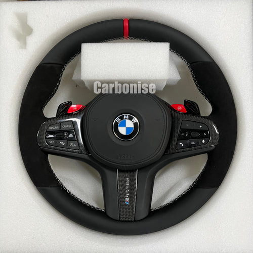 Custom BMW M performance steering wheel featuring black Alcantara grips, smooth leather top and bottom, a red racing stripe, and red M1/M2 button accents.