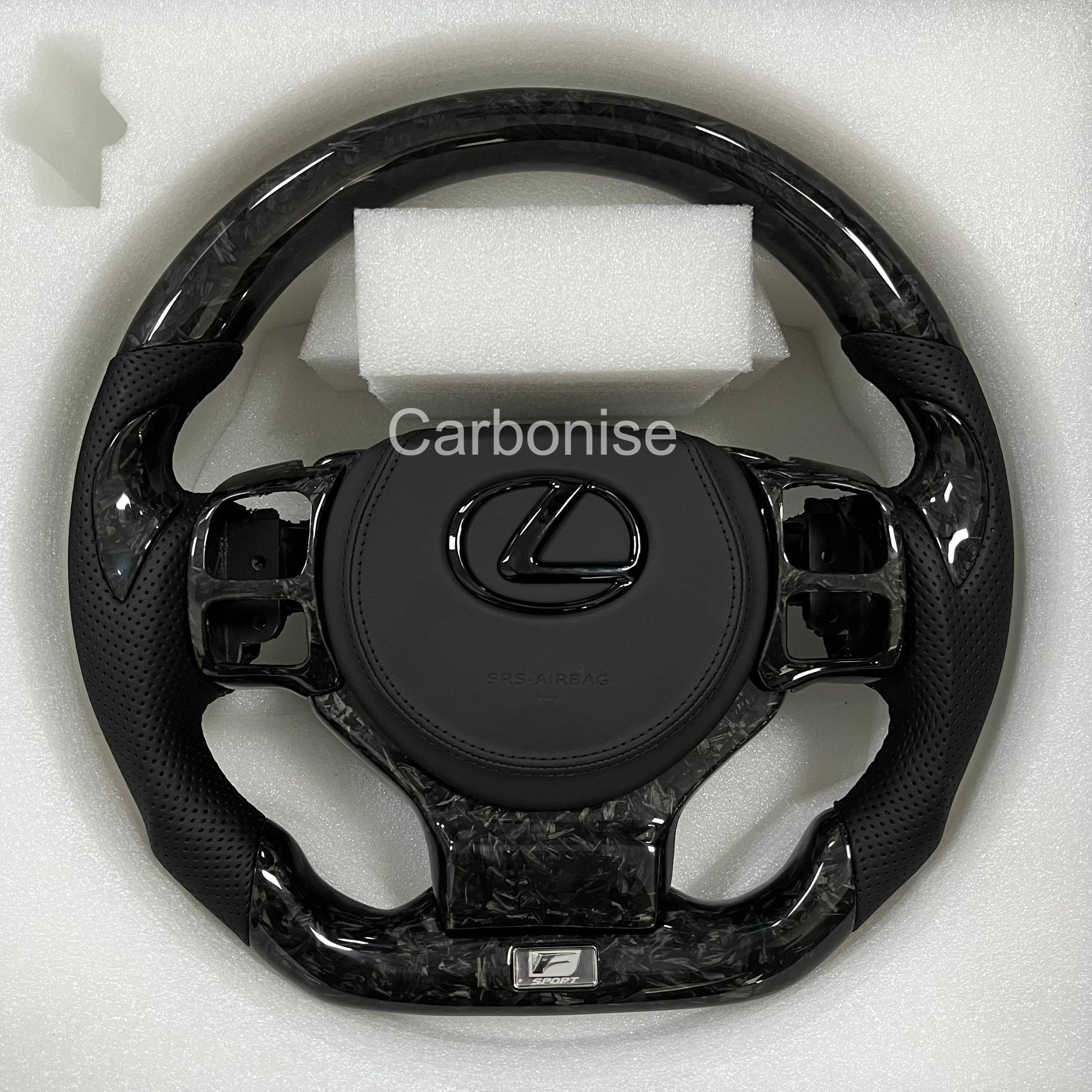 Carbonise Lexus forged carbon steering wheel with black forged carbon and perforated leather grips