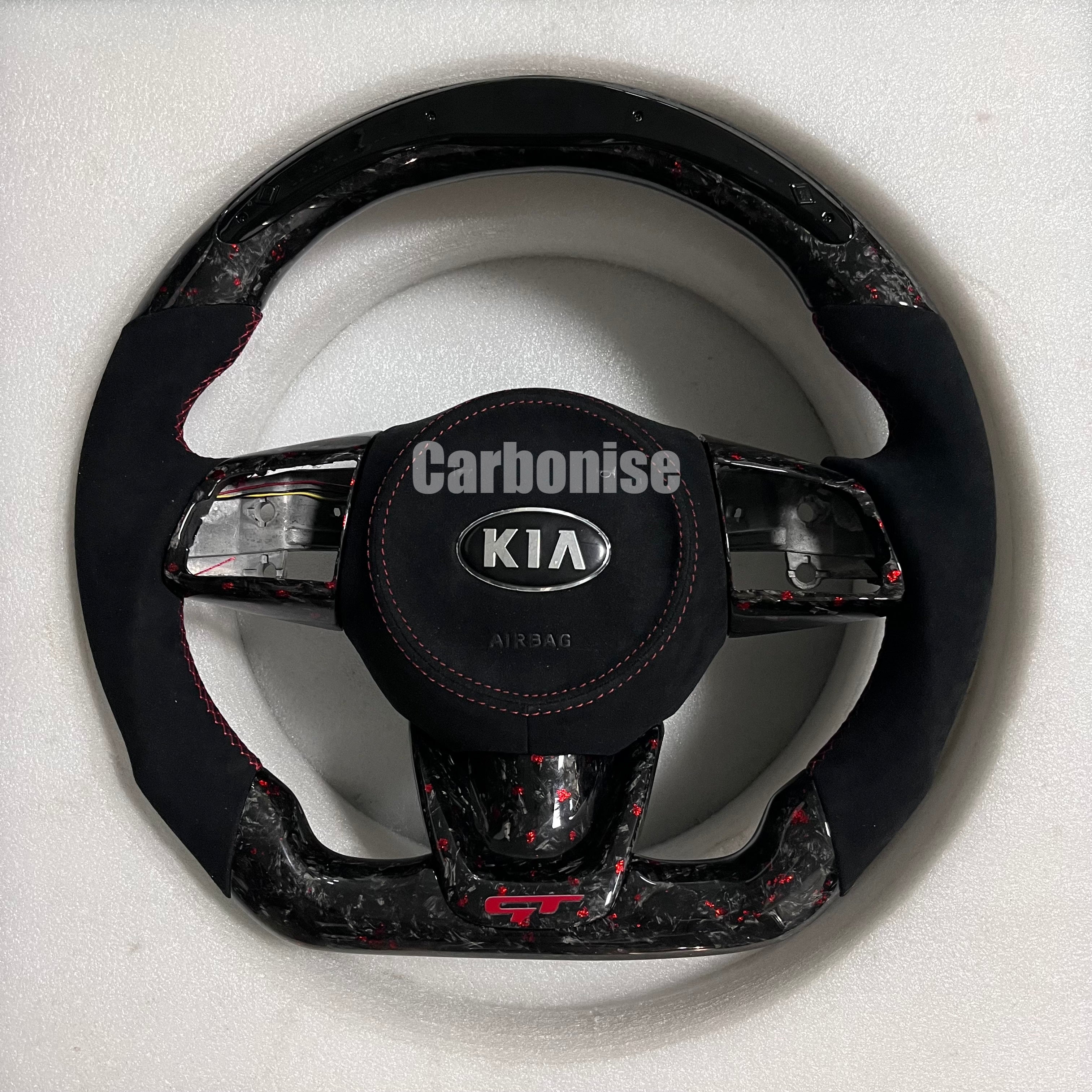 Carbonise Kia forged carbon steering wheel with Alcantara grip and red flake carbon, Led shifter light on top