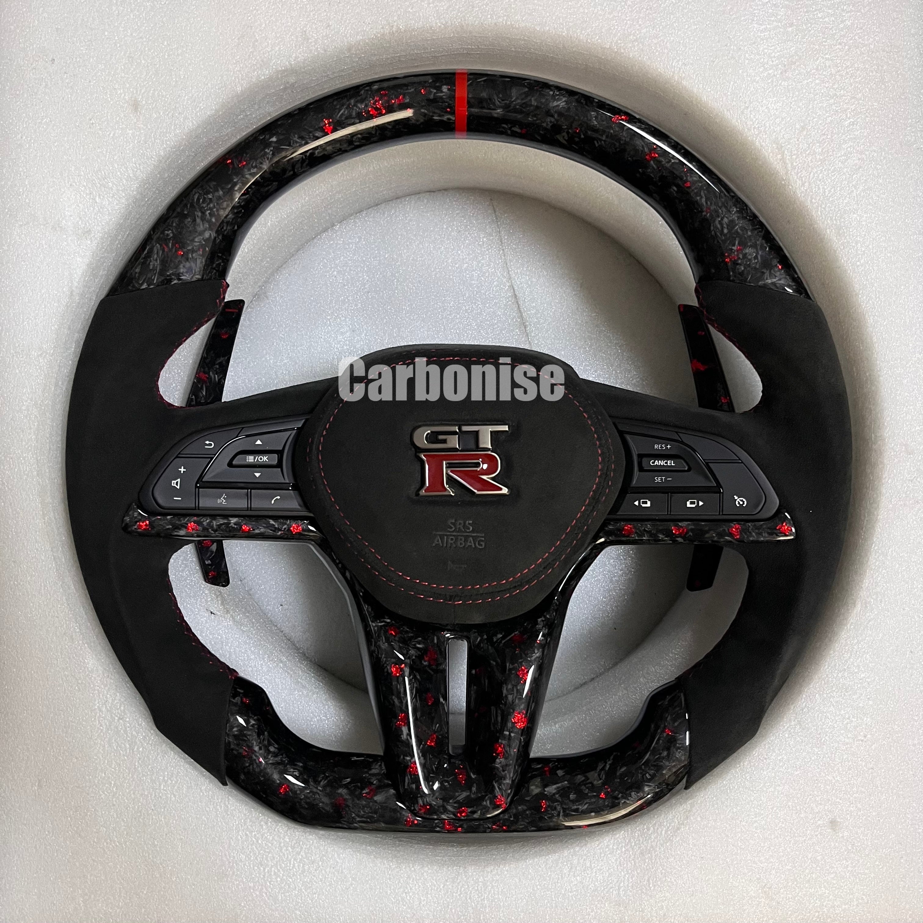 Carbonise Nissan GT-R carbon fibre steering wheel with Alcantara grips and red flake forged carbon