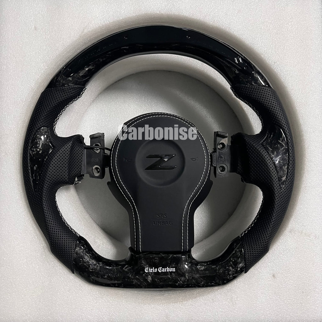 Carbonise Nissan Z carbon fiber steering wheel with perforated leather grips and gloss carbon finish