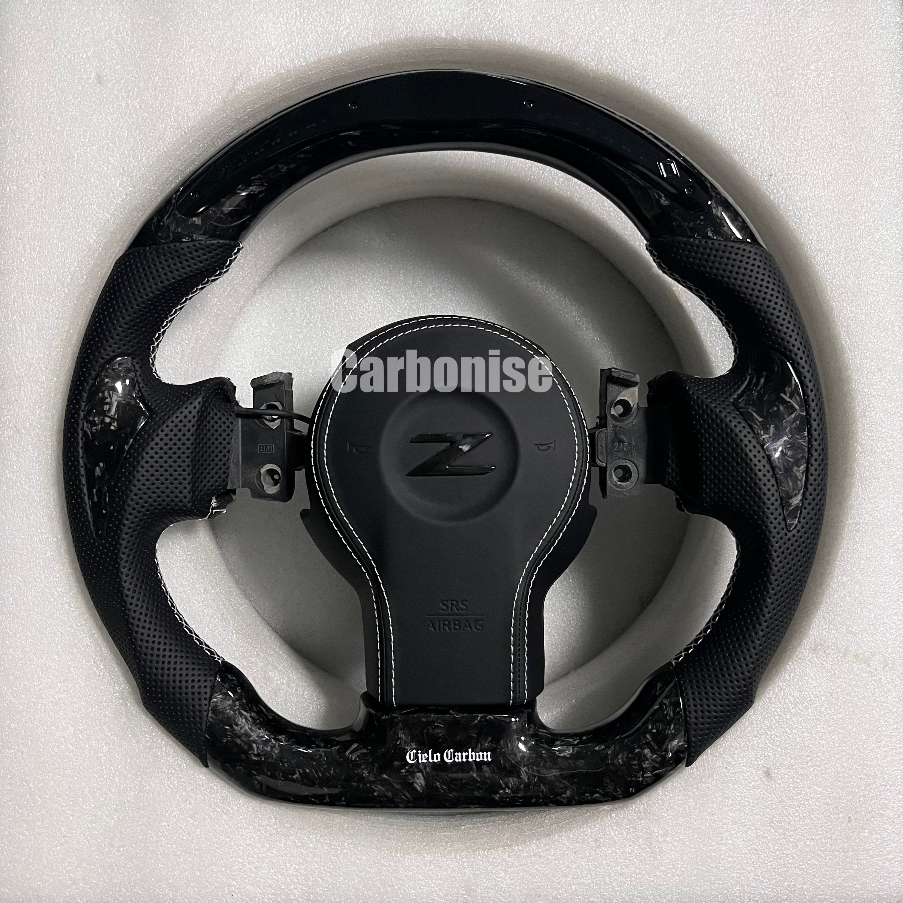 Carbonise Nissan Z carbon fiber steering wheel with perforated leather grips and gloss carbon finish
