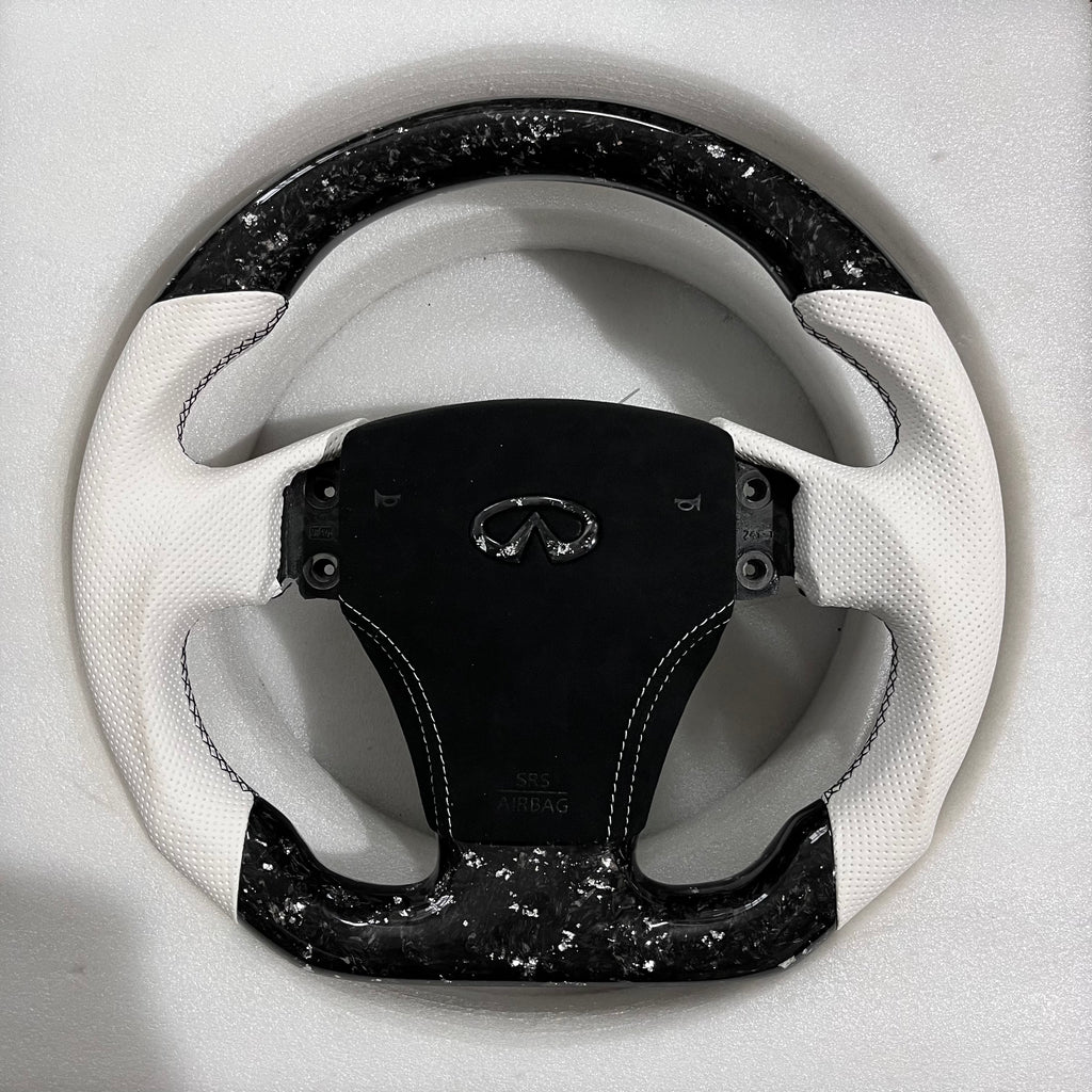 Carbonise Infiniti forged carbon steering wheel with white perforated leather grips