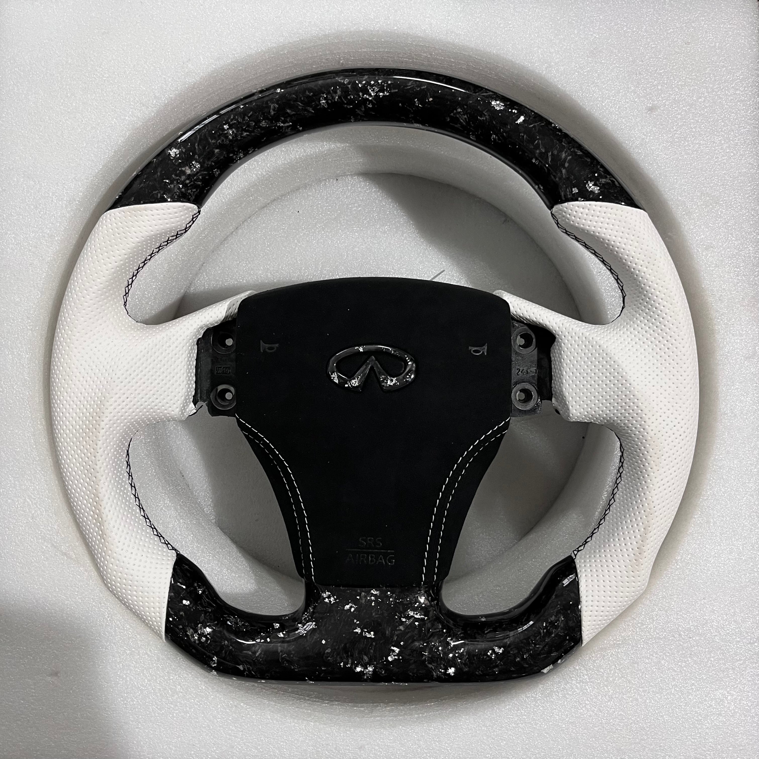 Carbonise Infiniti forged carbon steering wheel with white perforated leather grips