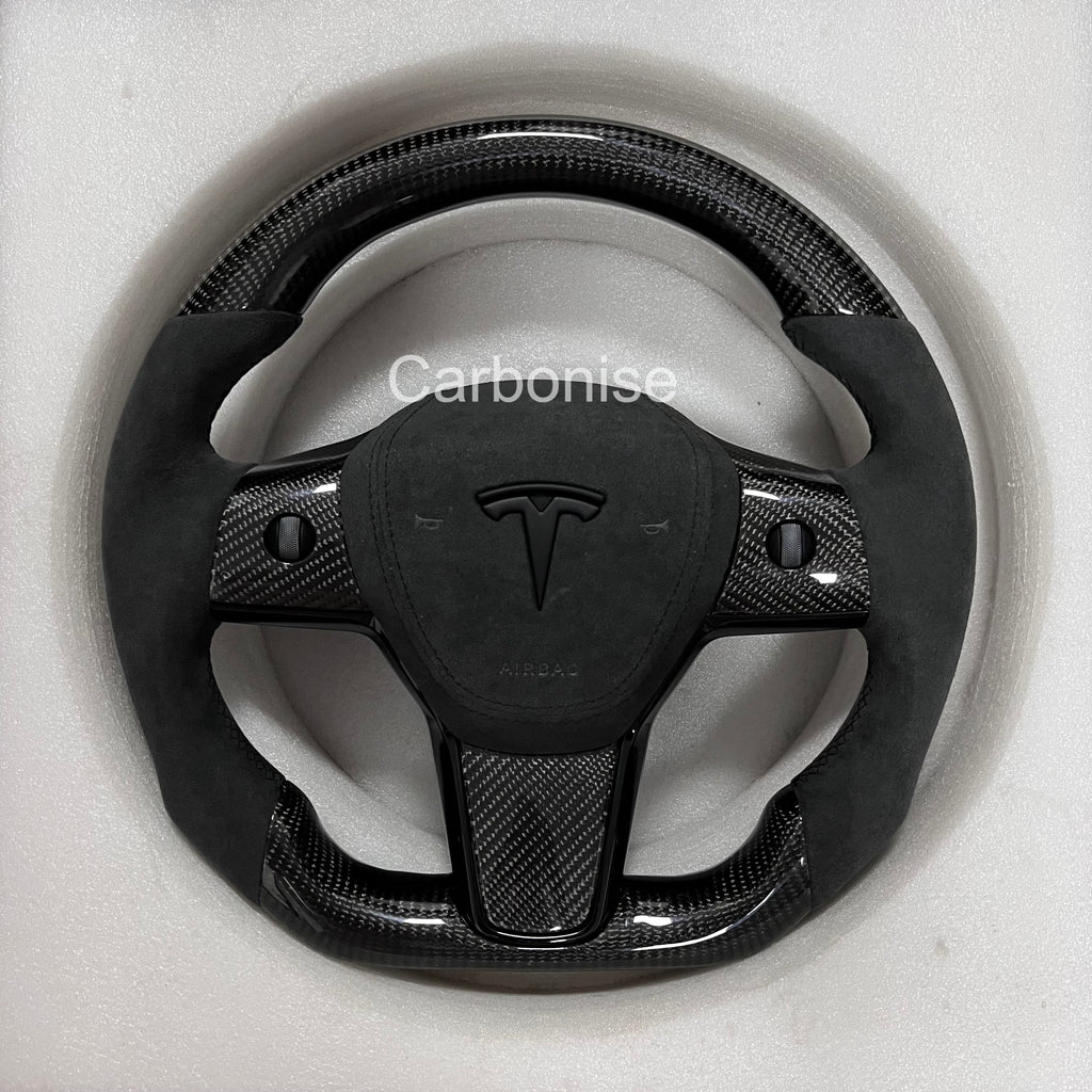 Carbonise Tesla carbon fiber steering wheel with black Alcantara grip and alcantara airbag cover
