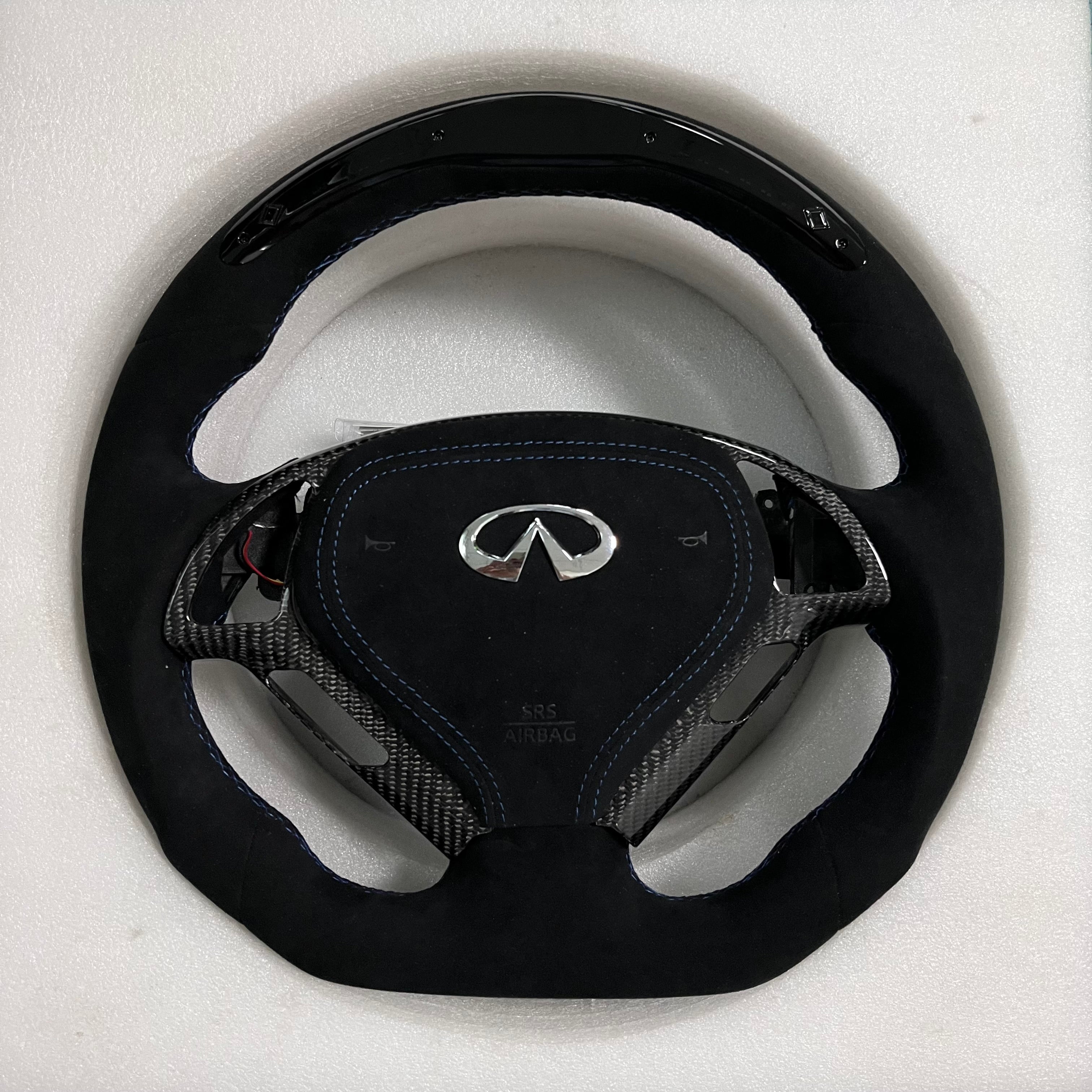 Carbonise Infiniti carbon fiber steering wheel with alcantara grips and blue stitching