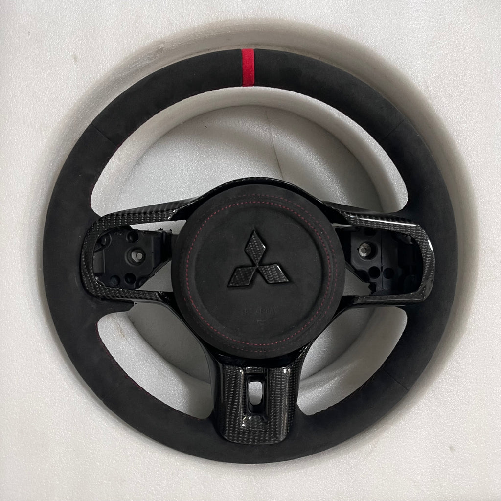 Carbonise Mitsubishi carbon steering wheel with Alcantara grips and red center stripe EVO10