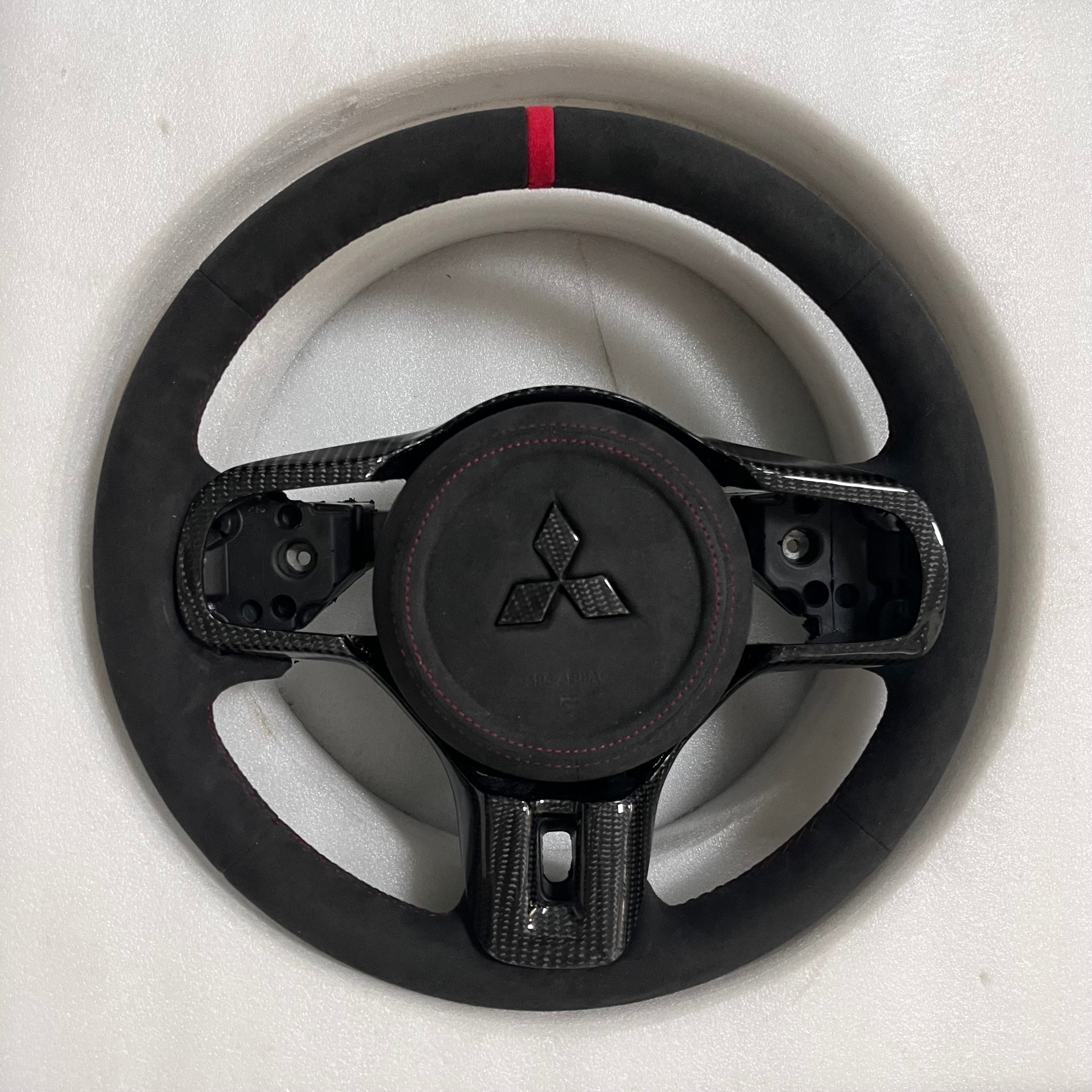 Carbonise Mitsubishi carbon steering wheel with Alcantara grips and red center stripe EVO10