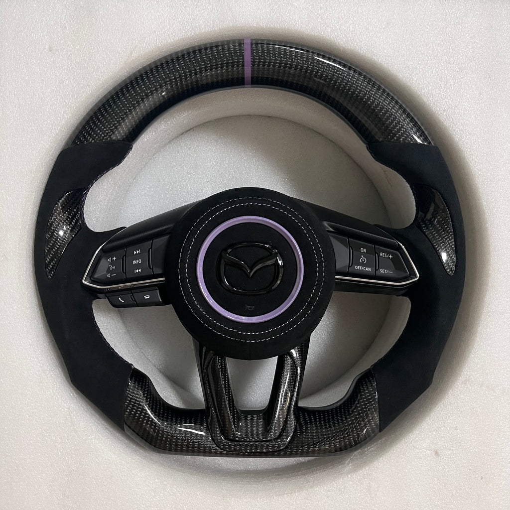 Carbonise Mazda carbon fiber steering wheel with Alcantara grip and purple center stripe