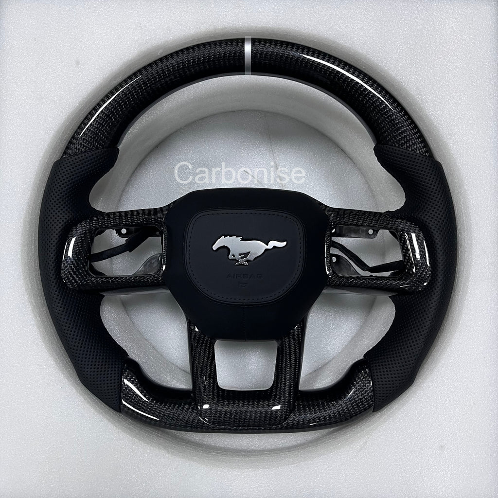 Ford Mustang carbon fibre steering wheel with perforated black leather grips, white centre stripe, round design, and OEM Mustang airbag.