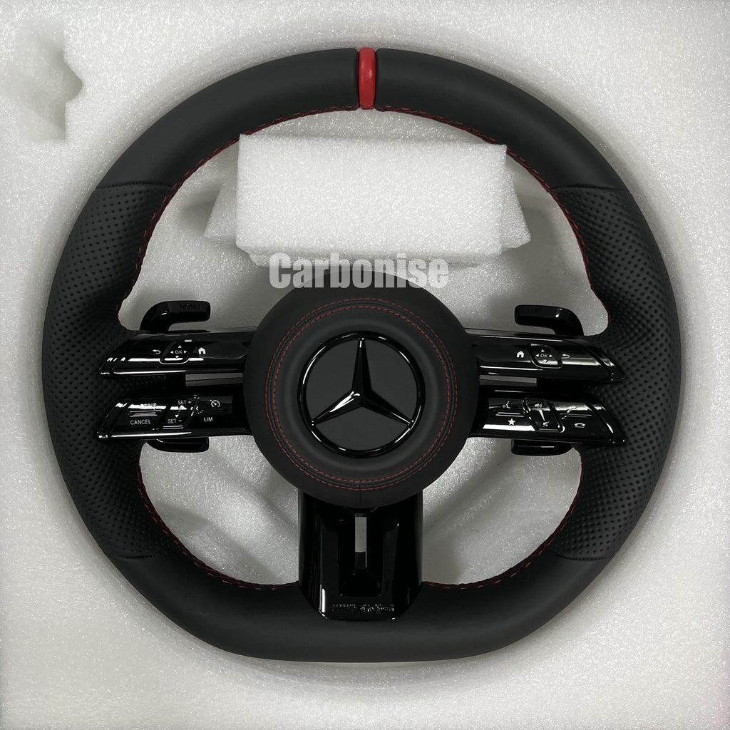 Custom Mercedes-Benz AMG steering wheel featuring a full black leather wrap, a red top racing stripe, and perforated side grips with red stitching.