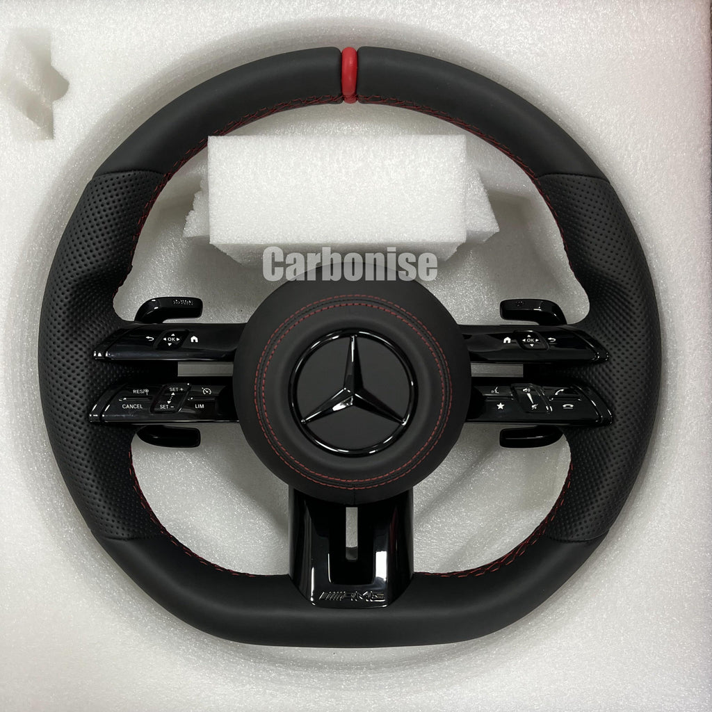 Custom Mercedes-Benz AMG steering wheel featuring a full black leather wrap, a red top racing stripe, and black perforated leather side grips with red stitching.
