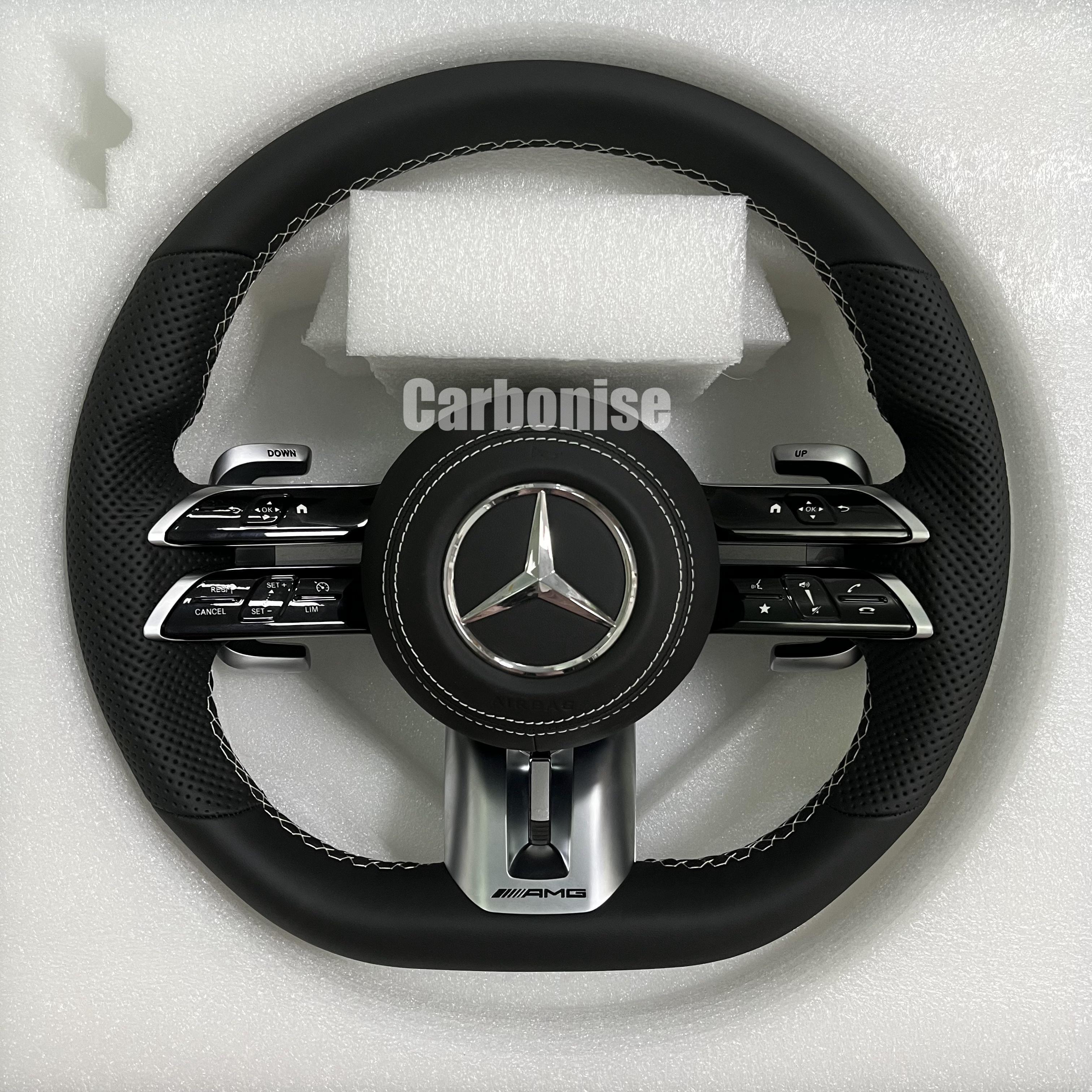 Custom Mercedes-Benz AMG steering wheel featuring a full black leather wrap, perforated side grips, and high-contrast silver stitching.