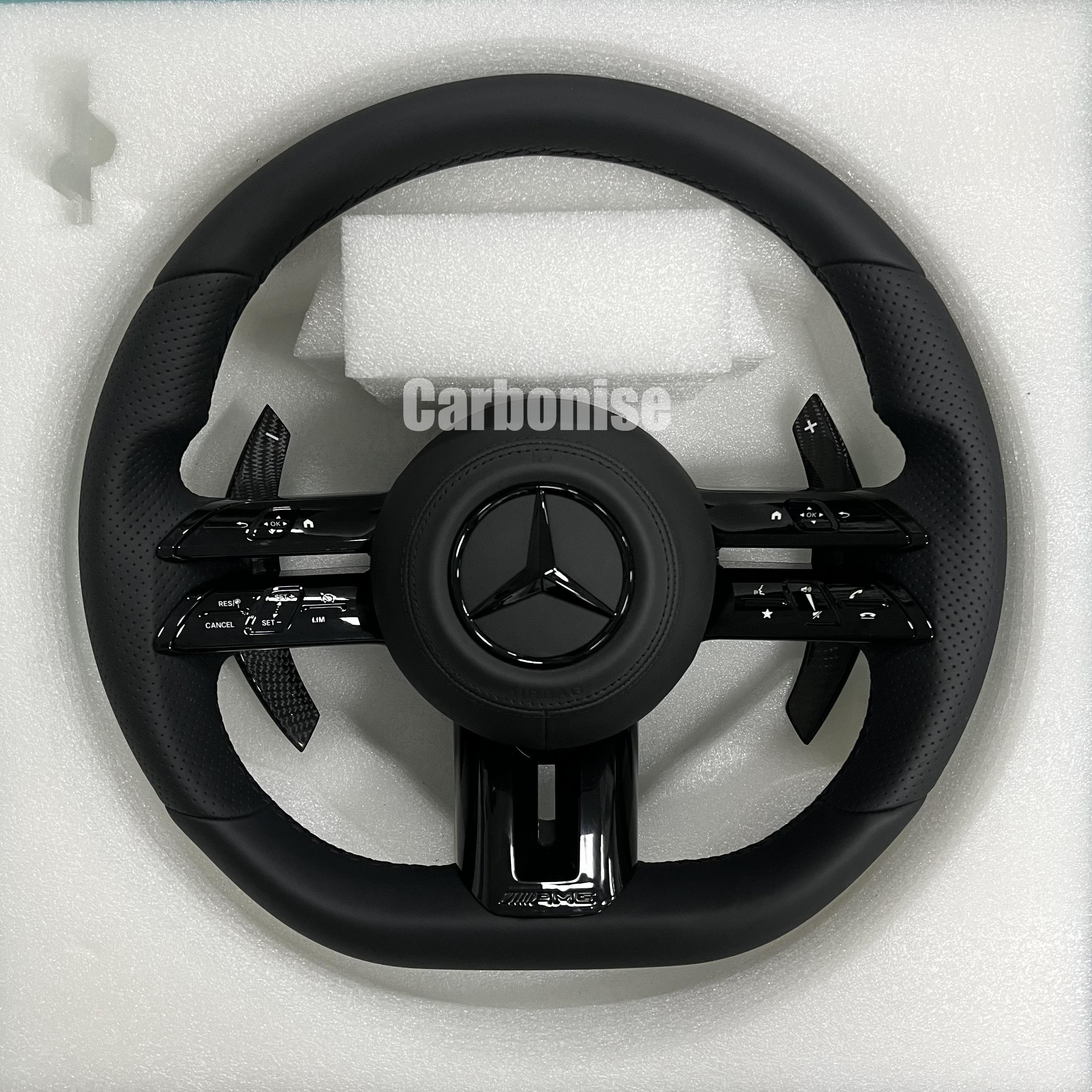 Custom Mercedes-Benz AMG steering wheel featuring a full black leather wrap with perforated side grips and integrated monochromatic black performance hardware.