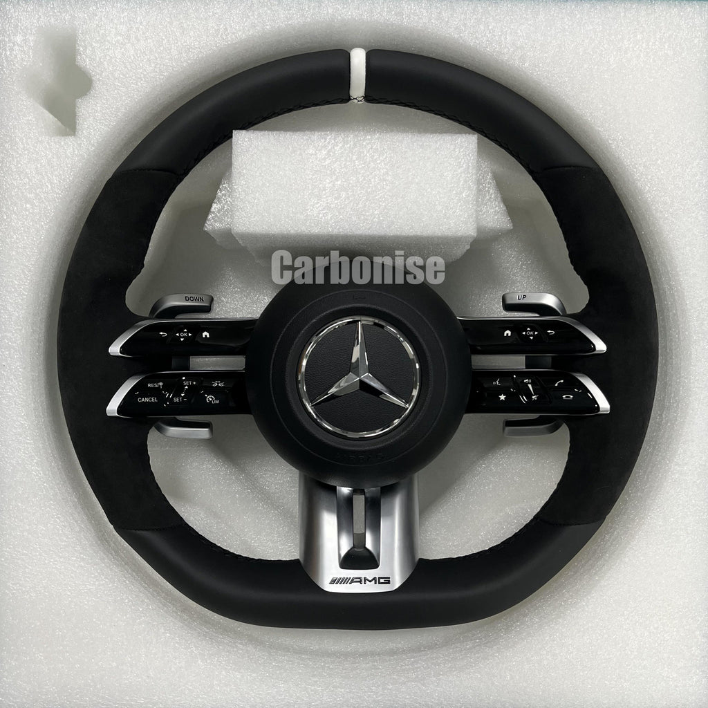 Custom Mercedes-Benz AMG steering wheel featuring a full black leather and Alcantara wrap with a white top racing stripe and silver hardware.