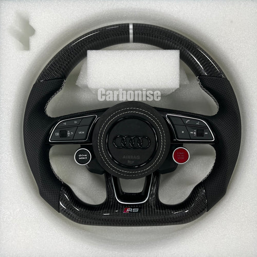 Custom Audi RS carbon fiber steering wheel featuring integrated red Start/Stop and black Drive Select buttons, a silver top racing stripe, and white stitching on perforated leather side grips.
