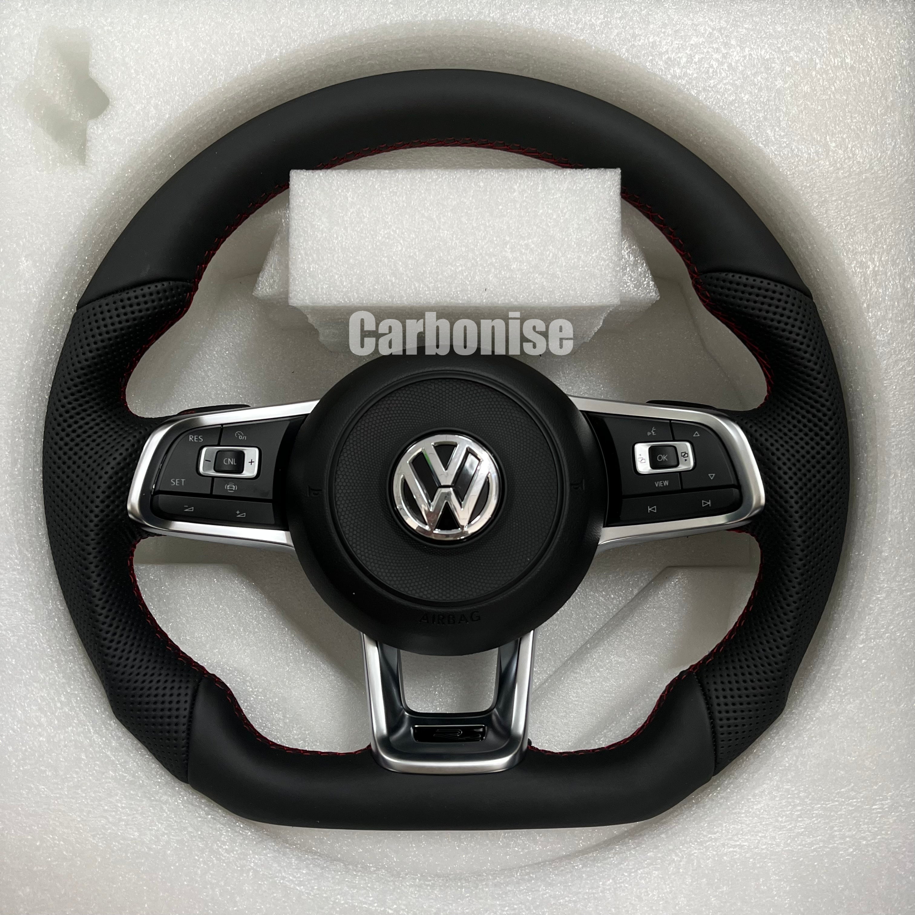 Custom Volkswagen performance steering wheel featuring a full black leather wrap, red performance stitching, and perforated leather side grips.