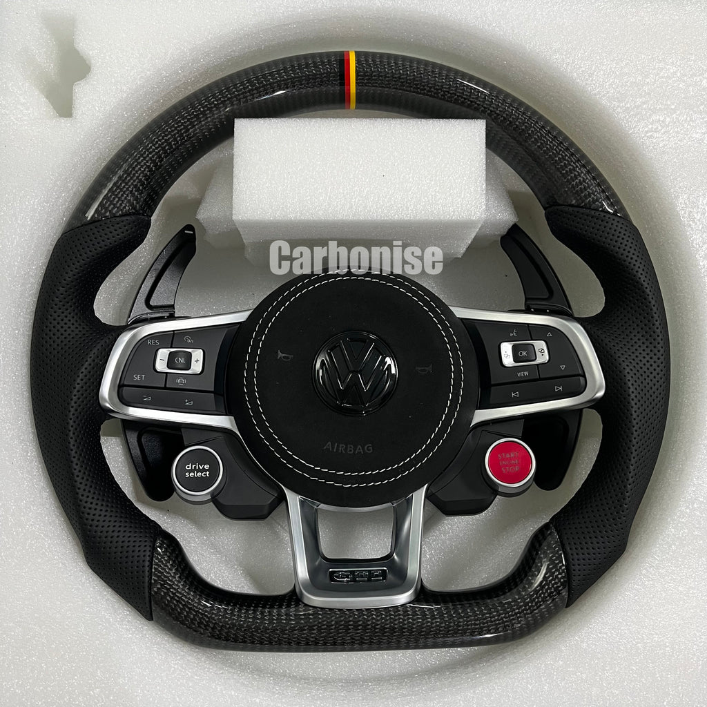 Custom Volkswagen performance steering wheel featuring high-gloss carbon fiber, a tricolor top racing stripe, and integrated R8-style red start/stop buttons.