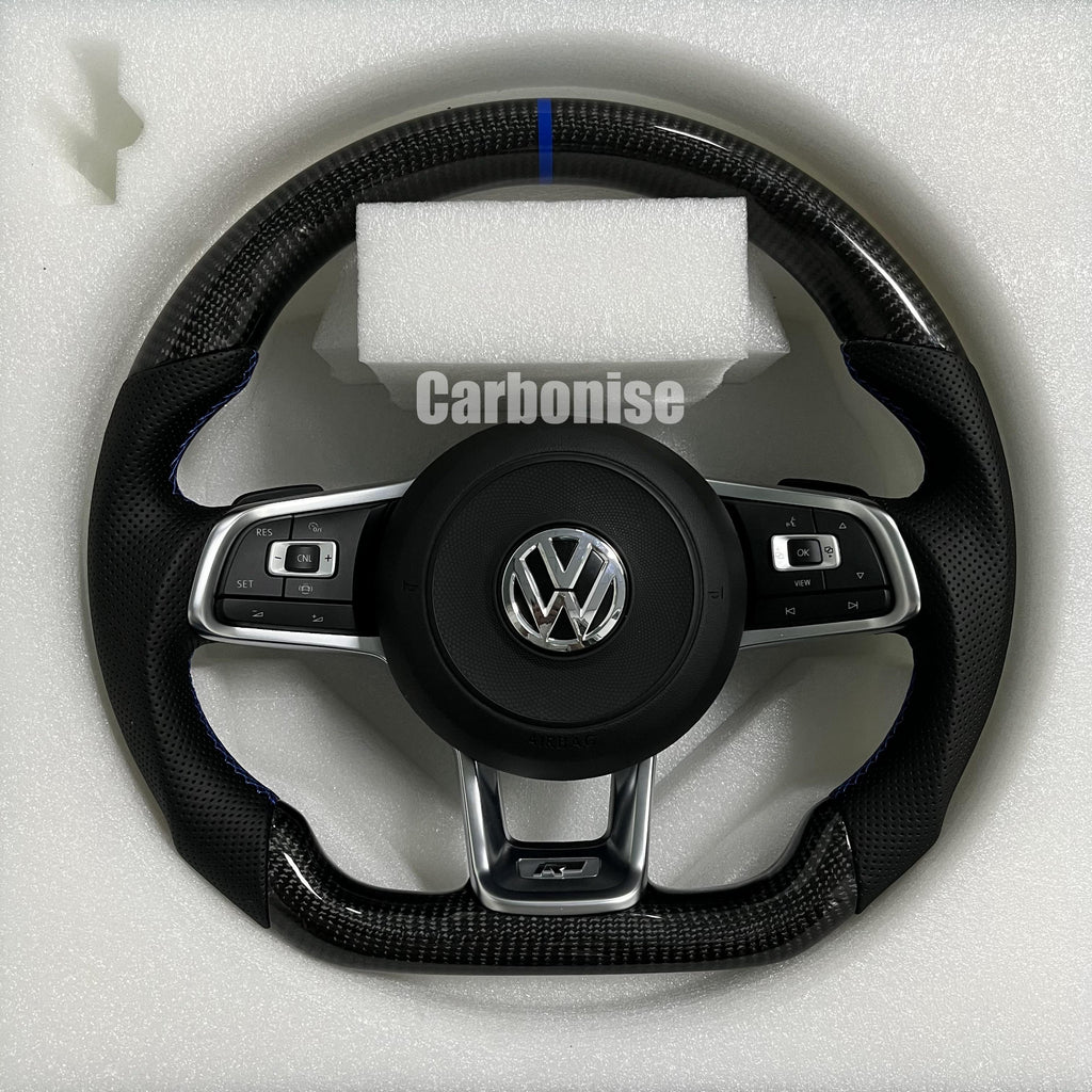 Custom Volkswagen performance steering wheel featuring high-gloss carbon fiber, a blue top racing stripe, and black perforated leather side grips with blue stitching.