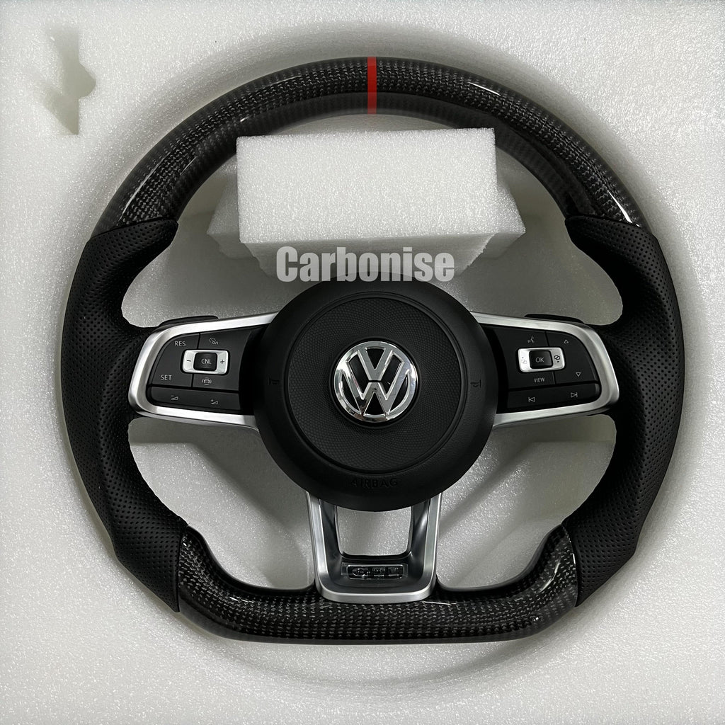 Custom Volkswagen performance steering wheel featuring high-gloss carbon fiber, a red top racing stripe, and black perforated leather side grips.