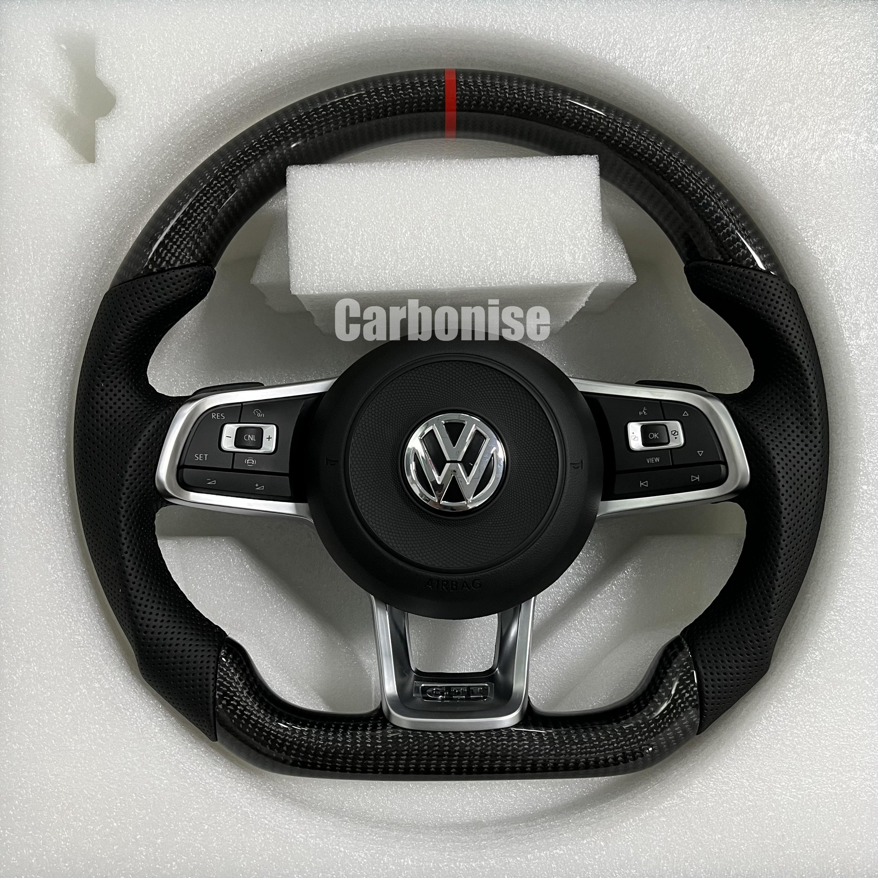 Custom Volkswagen performance steering wheel featuring high-gloss carbon fiber, a red top racing stripe, and black perforated leather side grips.